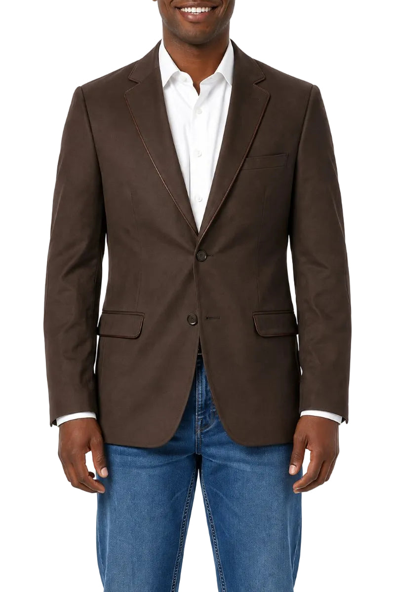 A man wearing a brown blazer over a white collared shirt and blue jeans, shown from the mouth down against a plain white background.