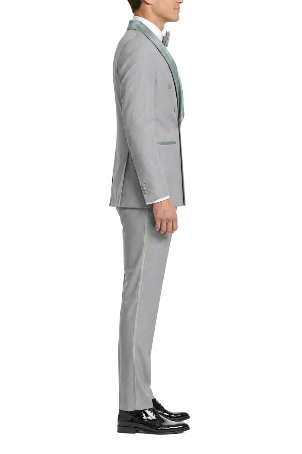 Man wearing a gray suit with a white shirt and black shoes on a white background