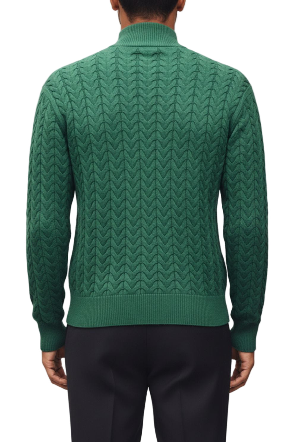 Green cable knit sweater worn by a person on a white background