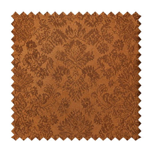 A square fabric swatch with serrated zigzag edges, featuring a warm rust-brown damask pattern on a lighter tan background, shown against a plain white background.