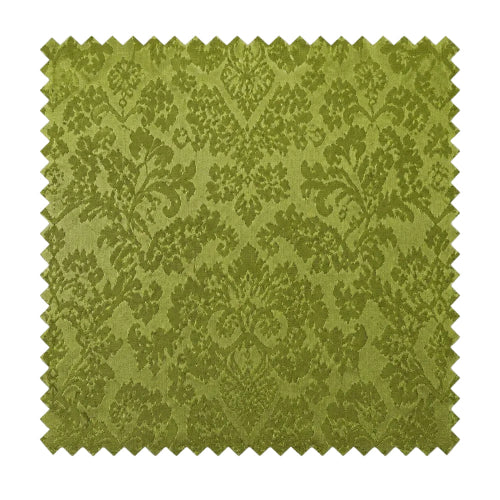 A square fabric swatch with a scalloped zigzag edge, featuring an olive green damask pattern on a lighter yellow-green background, shown against a plain white background.