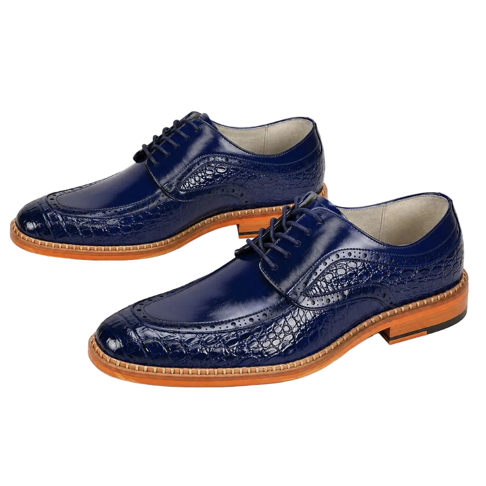 A pair of men's navy blue brogue oxford shoes with a crocodile-embossed texture, featuring brown leather soles and black laces, displayed on a clean white background.
