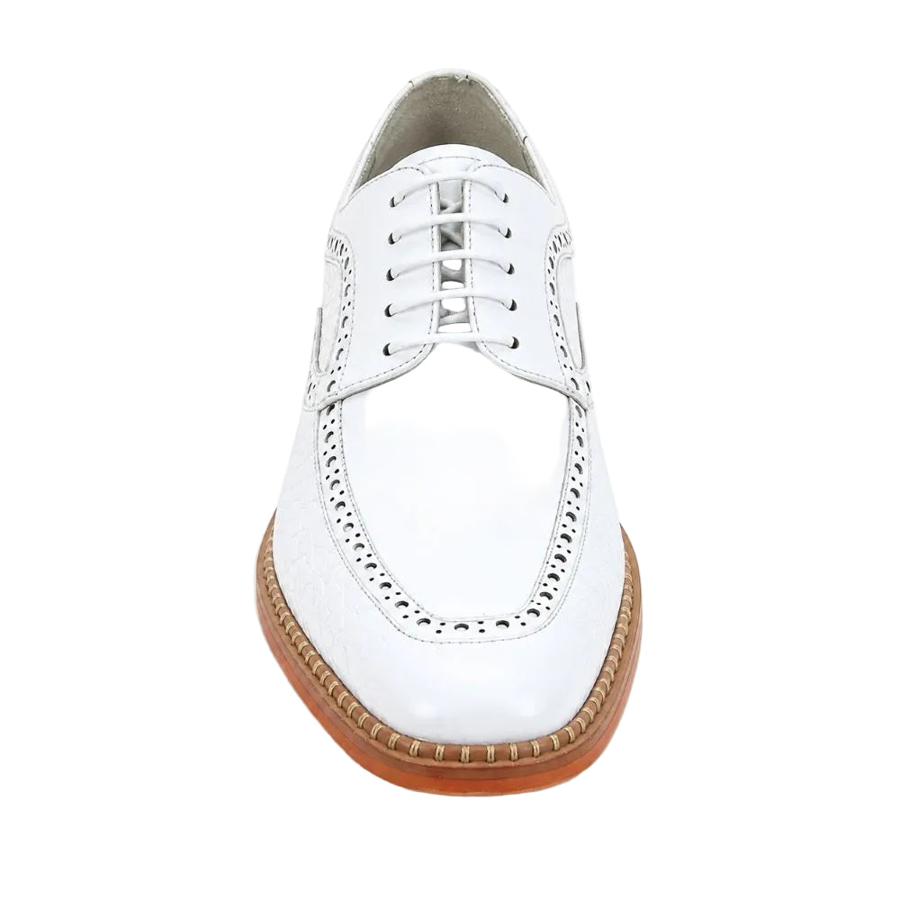 A white leather lace-up wingtip shoe with decorative perforated detailing and a brown gum sole, shown from a front-facing perspective on a white background.
