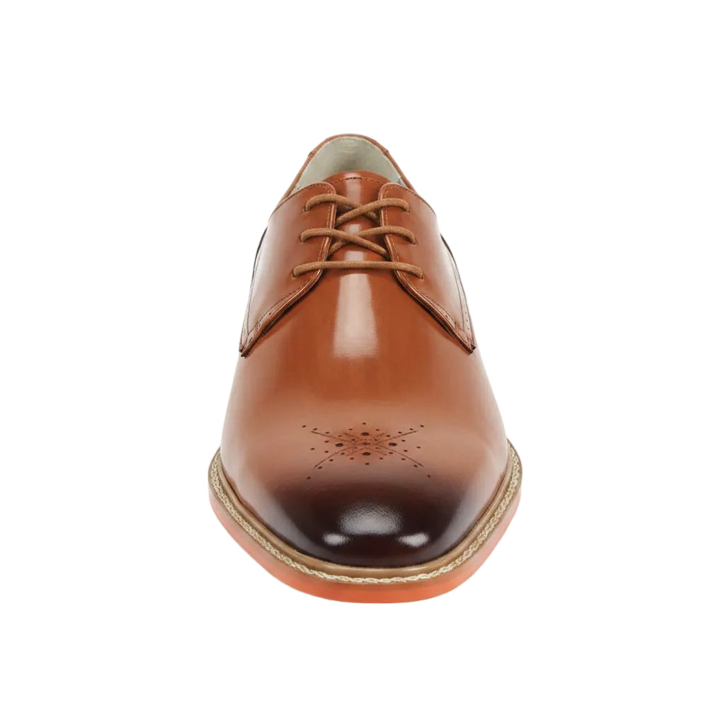 Tan leather dress shoe on a white background