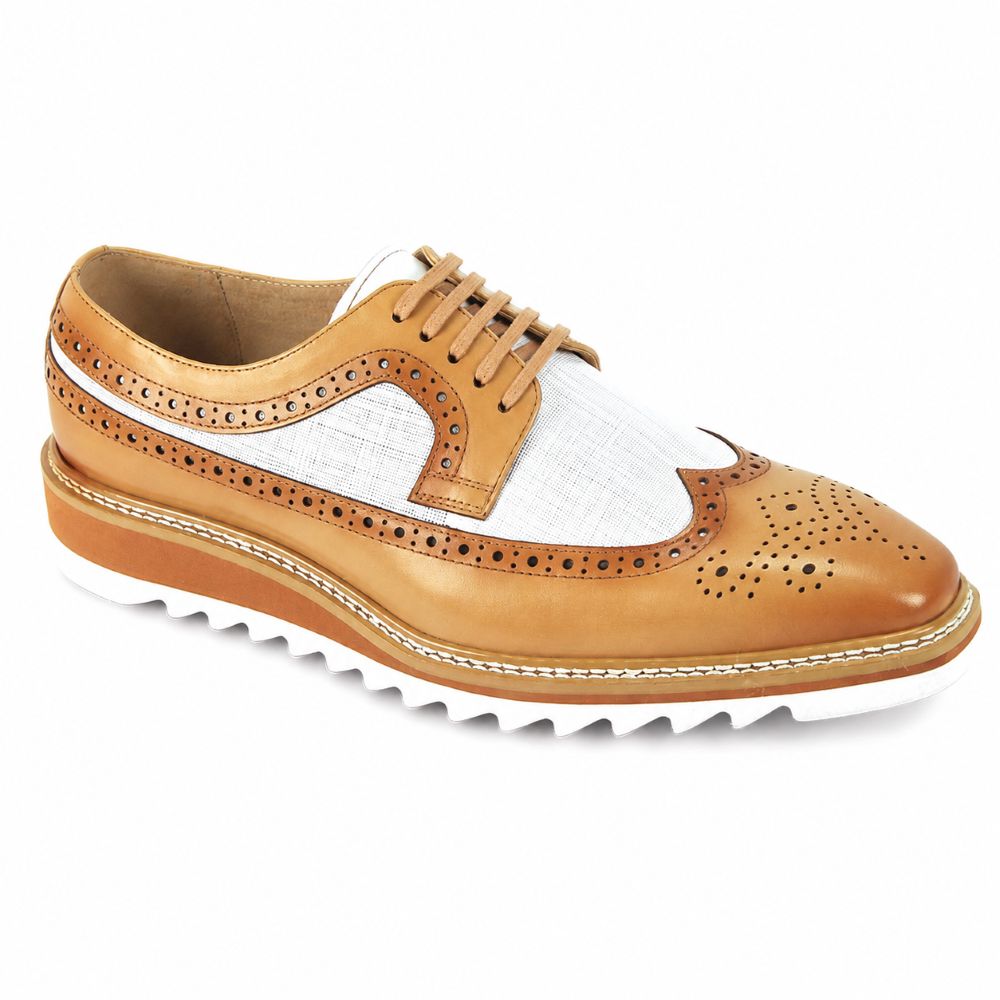 A men's wingtip oxford shoe featuring tan leather brogue detailing, a white woven fabric toe panel, and a white zig-zag sole, shown on a plain white background.