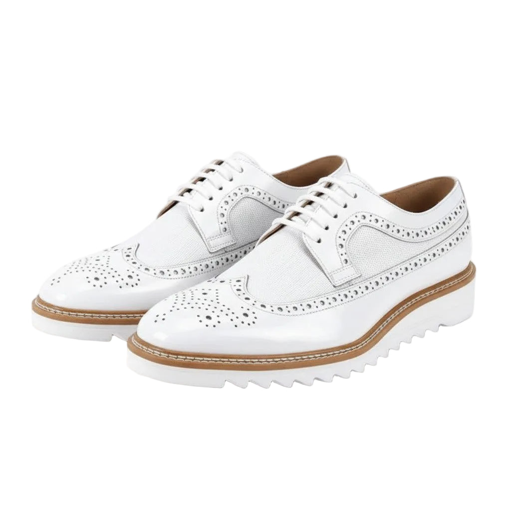 White leather shoes with brown soles on a white background
