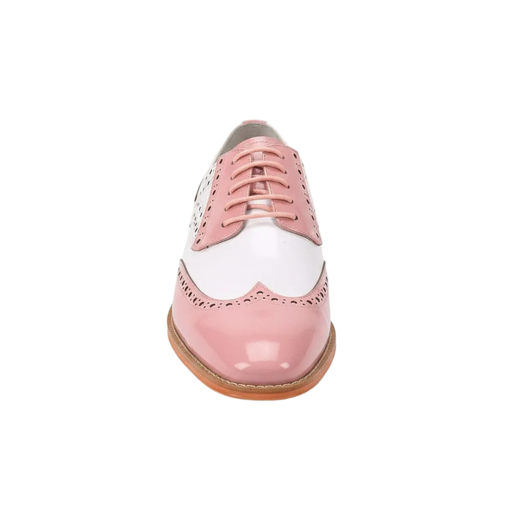Pink and white brogue shoe on a white background