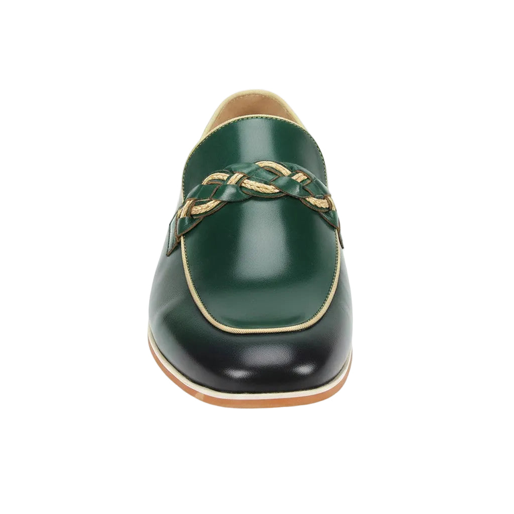 Green loafer shoe with braided detail on a white background