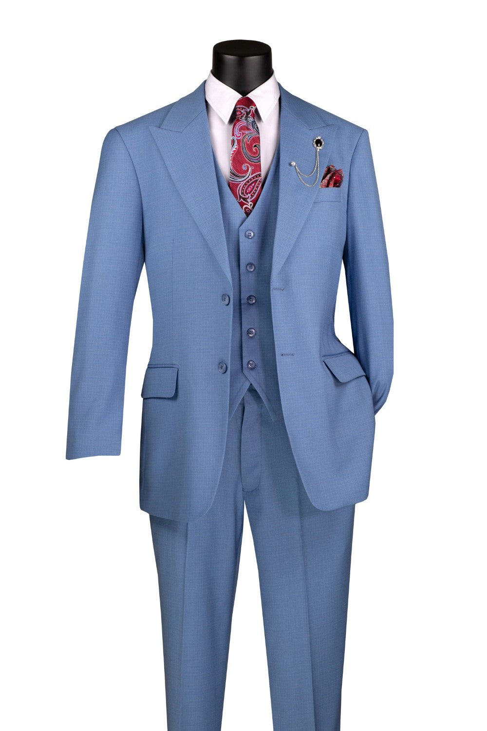 A mannequin wearing a dusty blue regular fit 3 piece suit with a vest and adjustable waist band pants. Includes a tie and flower accessory.