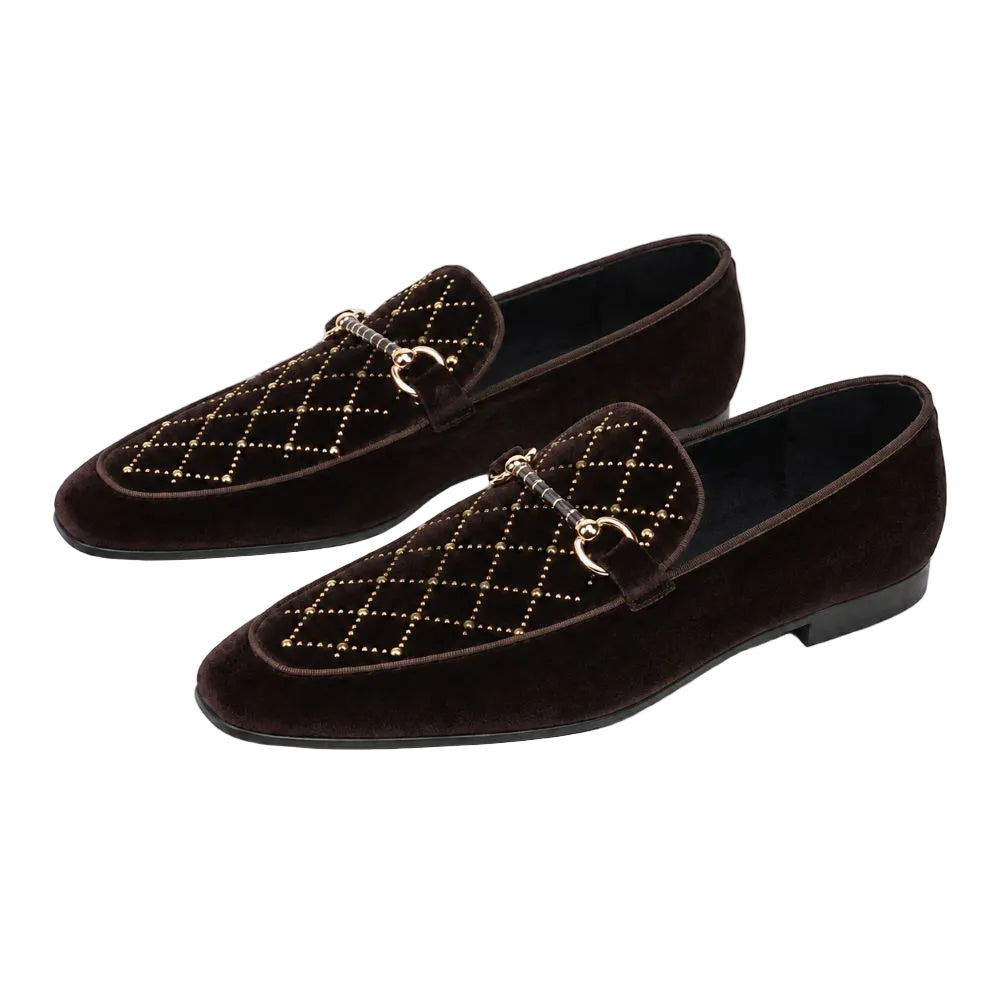 A pair of dark brown suede loafers with a quilted diamond pattern and gold-tone horsebit hardware on the vamp, displayed against a clean white background.