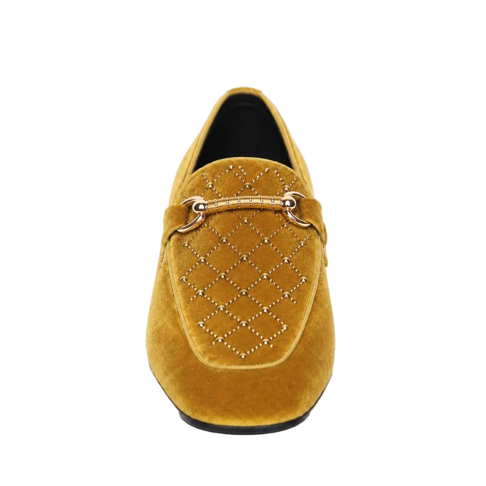 A single mustard yellow suede loafer with a quilted diamond pattern and gold-tone studs, featuring a decorative horsebit strap on the vamp, shown against a plain white background.