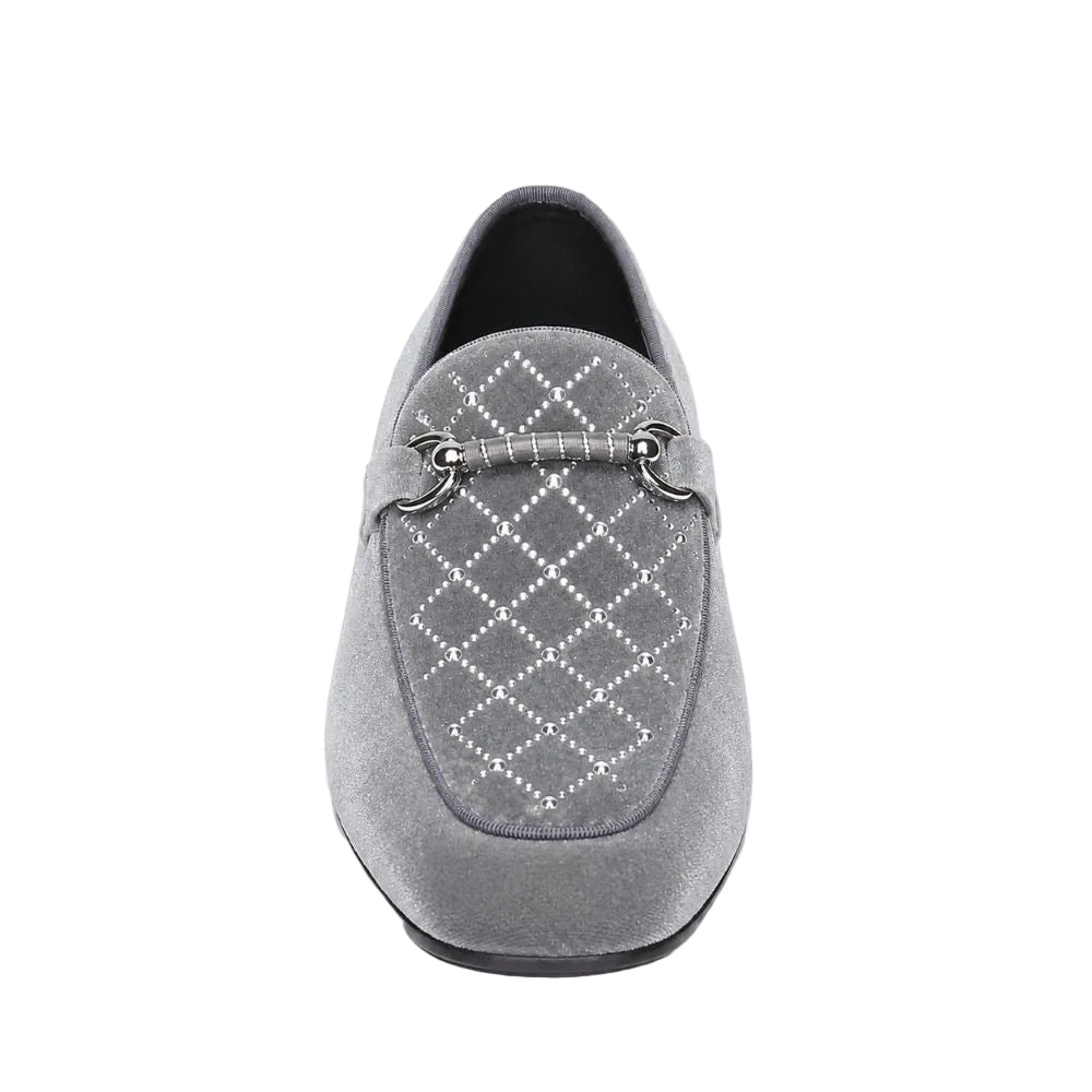 A single gray suede loafer shown from a front-facing overhead perspective on a white background. The shoe features a diamond pattern of small silver rhinestones across the vamp and a matching gray strap with silver metal rings.