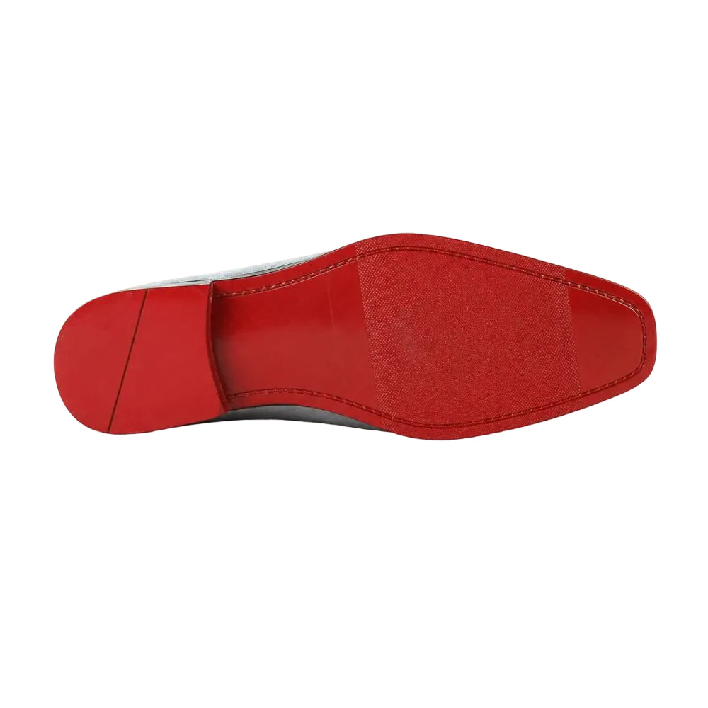 A close-up, top-down view of a red leather shoe sole, showing the outsole pattern and heel block on a white background.