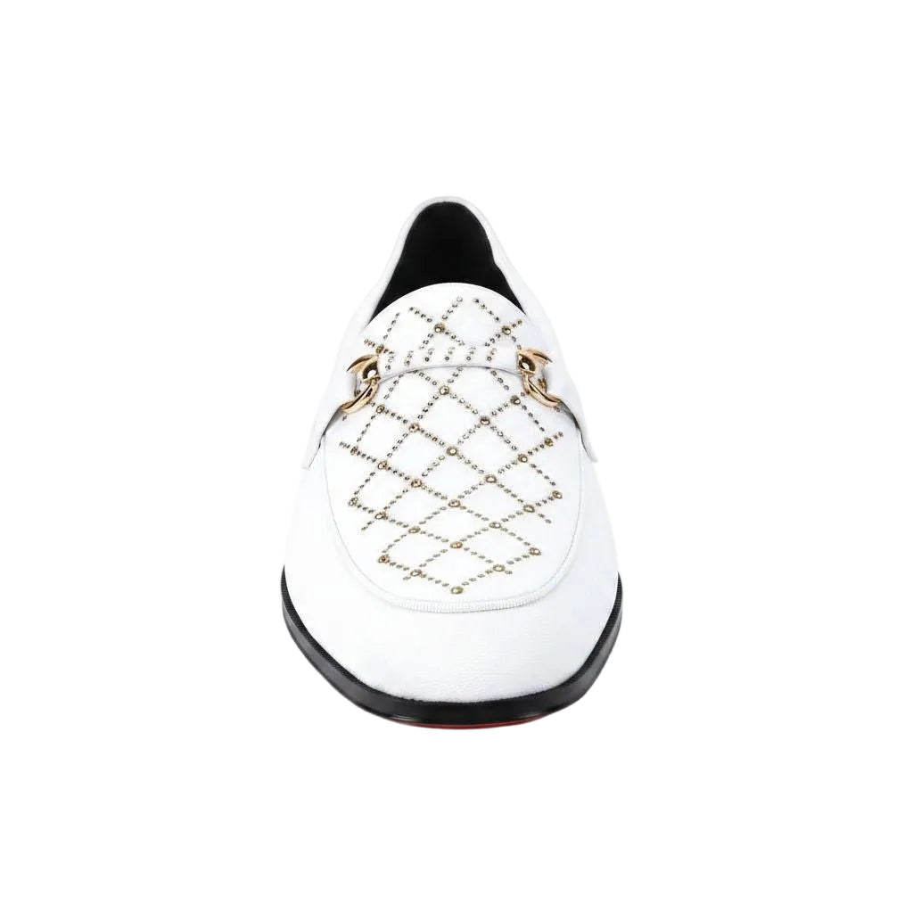 White loafer with gold detailing on a white background