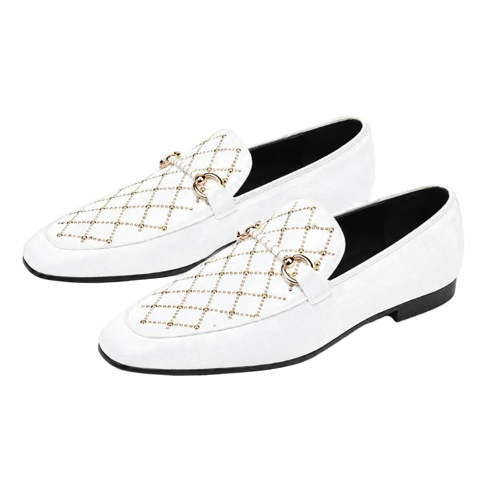 A pair of white suede loafers with gold-tone chain-link quilted detailing and horsebit hardware on the vamp, shown against a plain white background.