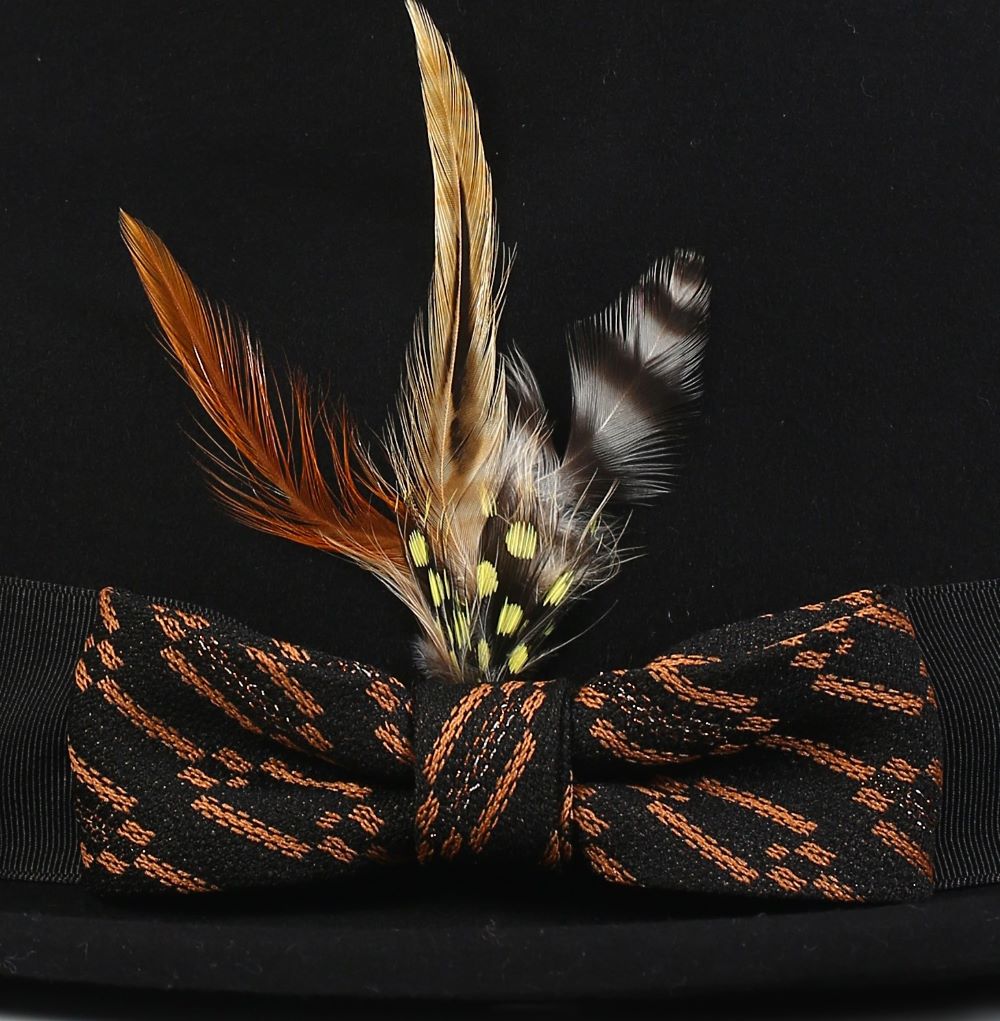 Solid black wool felt fedora hat featuring a cognac ribbon and a 2½ inch brim.