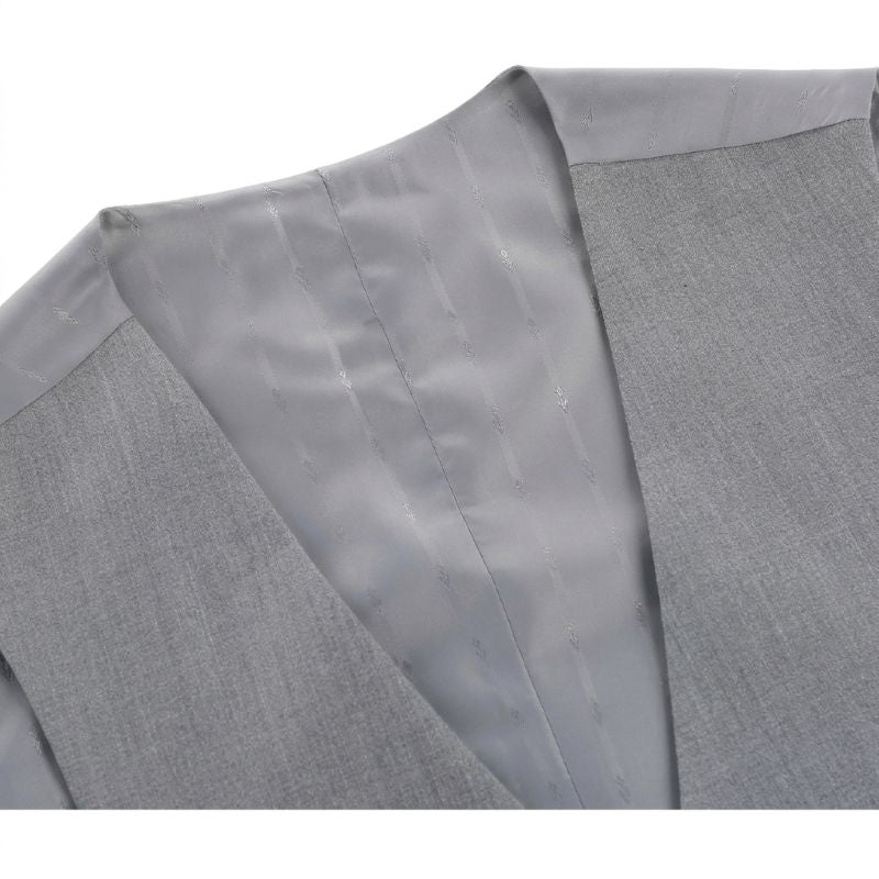 Close-up of a light gray textured fabric garment, showing the collar and inner lining with subtle vertical stitching.