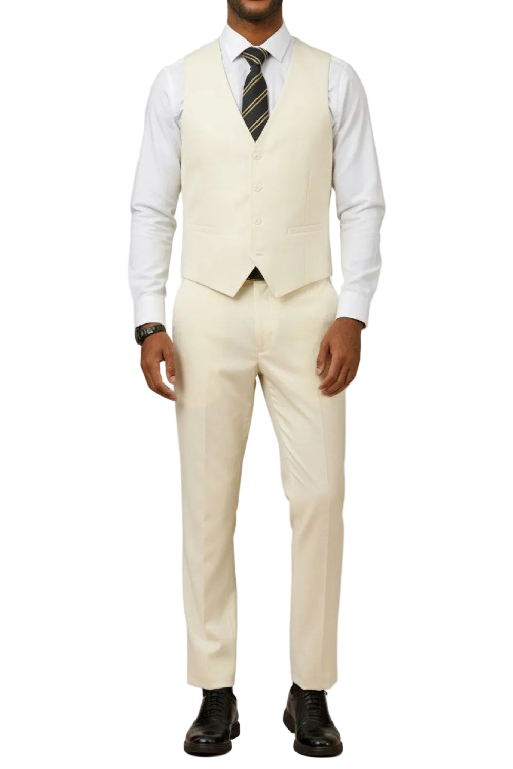 Man wearing a cream vest and pants with a white shirt and black shoes on a white background