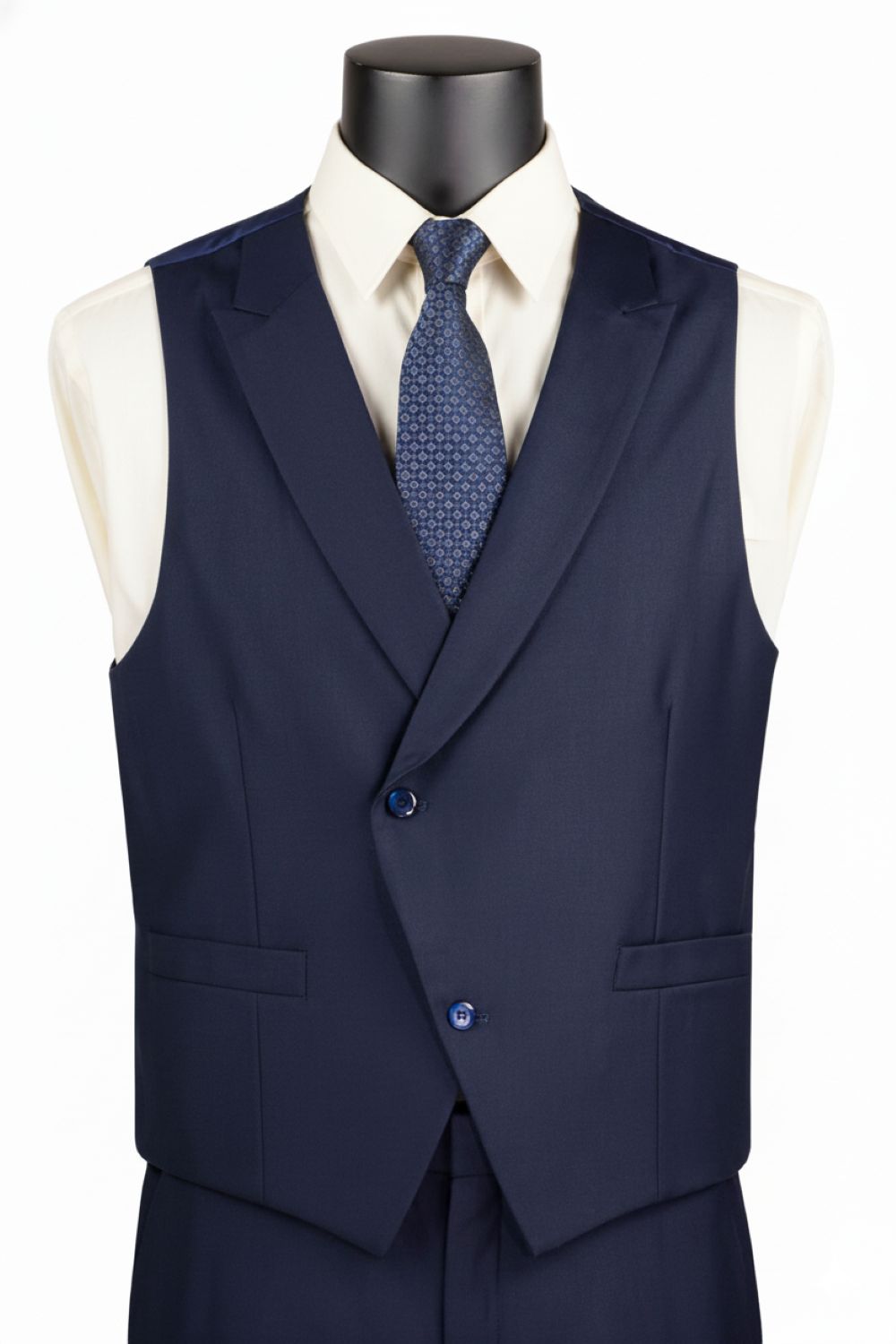 Navy blue vest with a white shirt and blue tie on a mannequin against a white background