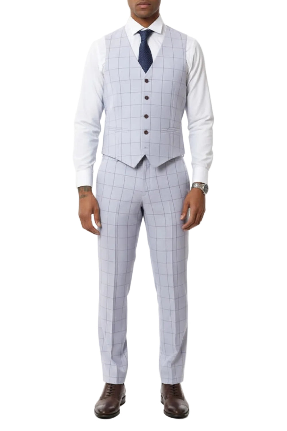 Man wearing a light gray checkered suit with a white shirt and brown shoes on a white background