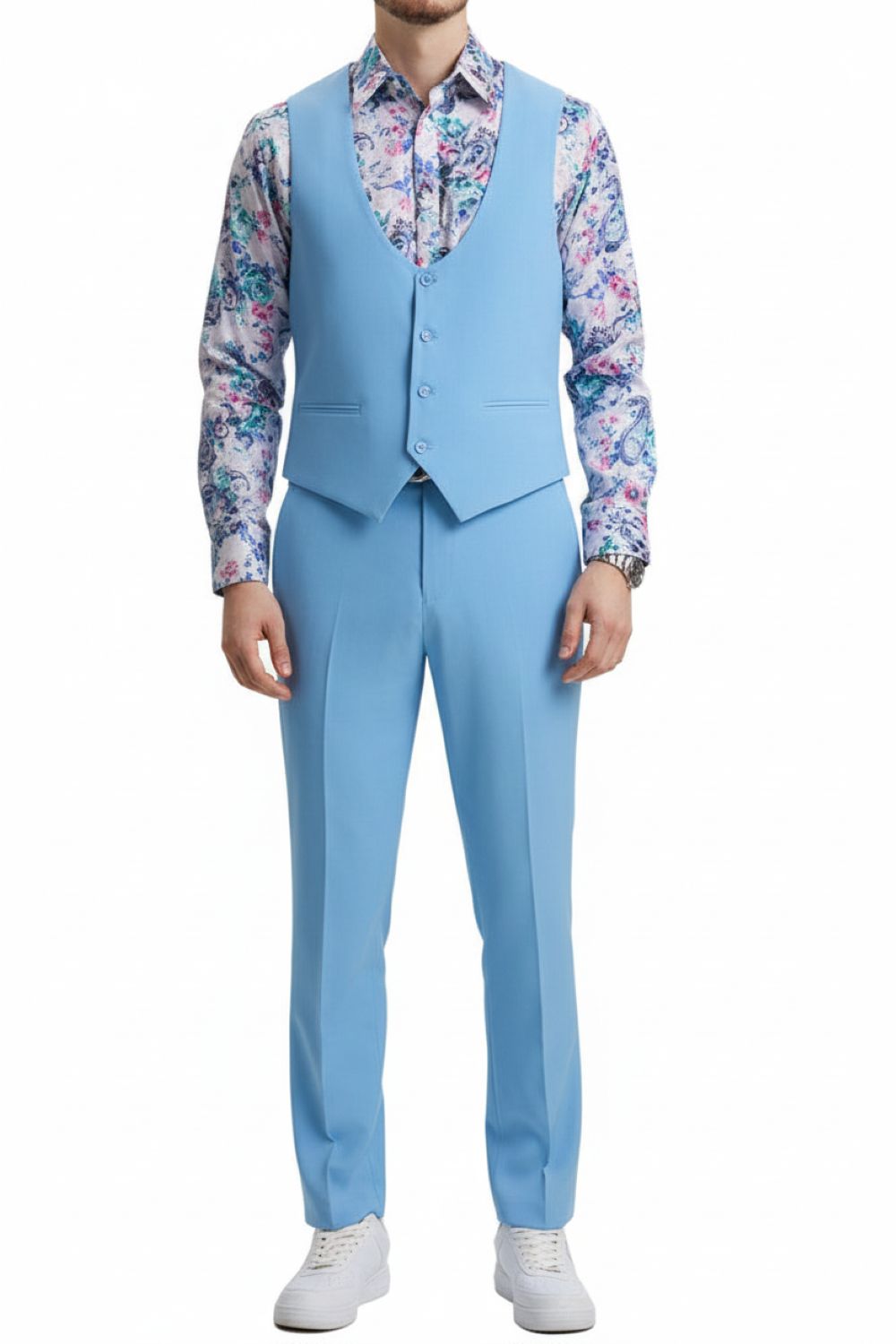 Man wearing a light blue suit with a floral shirt on a white background
