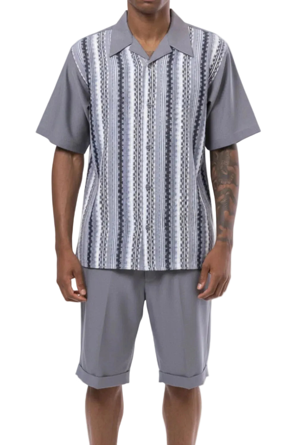 Man wearing a gray patterned shirt and shorts on a white background