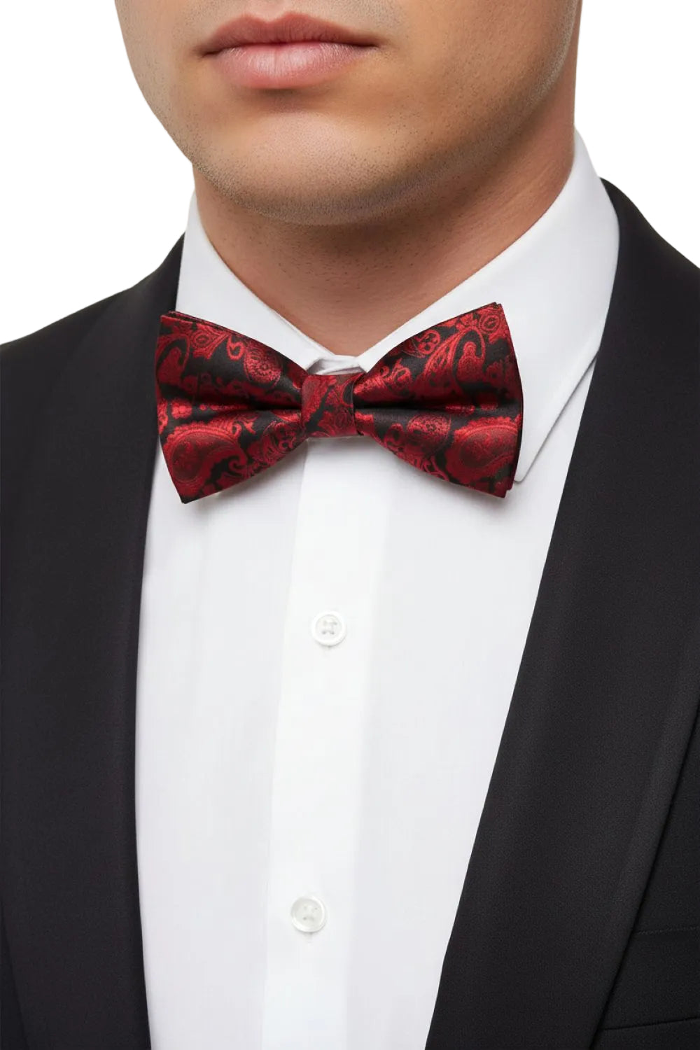Red patterned bow tie worn by a person in a black suit and white shirt.