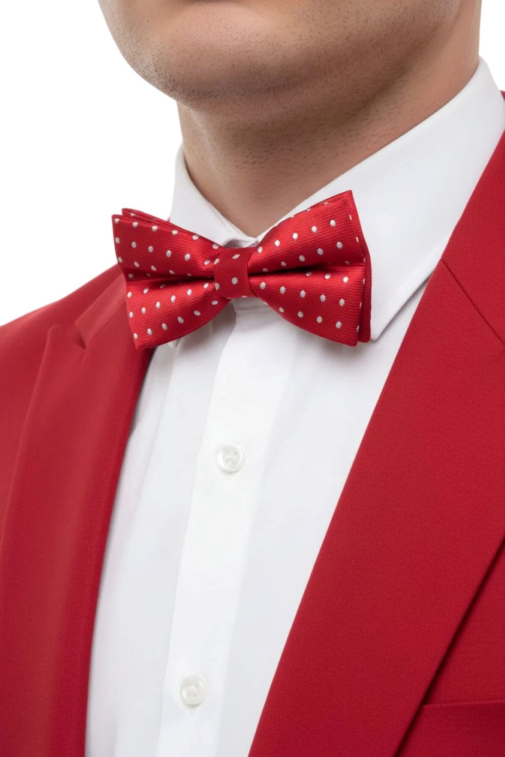Person wearing a red bow tie with white polka dots and a red jacket.