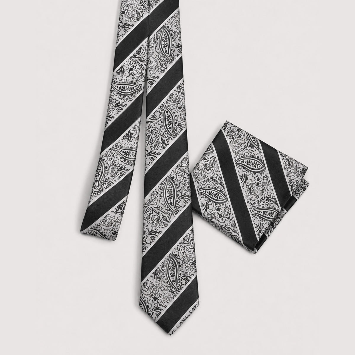 Black white and gray paisley men's necktie and matching pocket square set