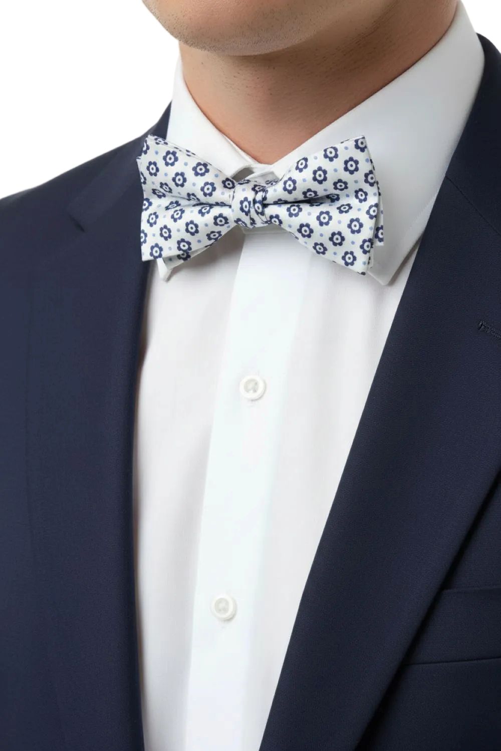 Navy suit with a white shirt and patterned bow tie