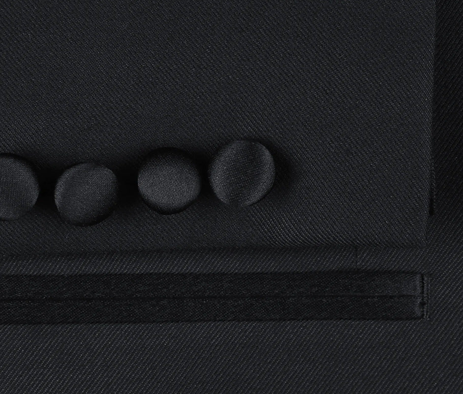 Close-up of a solid Classic Regular Fit 2 Piece Black Dress Tuxedo Peak Lapel jacket, showing a button, collar, and pocket.