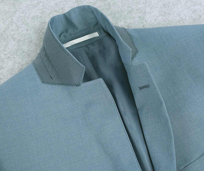 Renoir solid Slim Fit 2 Piece Light Blue Suit blazer, showing collar, buttons, and pocket.
