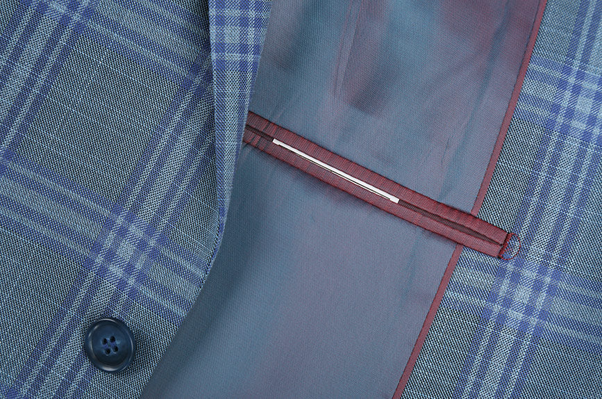 A checkered Renoir Regular Fit 2 Piece Suit Glen Plaid in Blue jacket, showing notch lapels and front buttons.