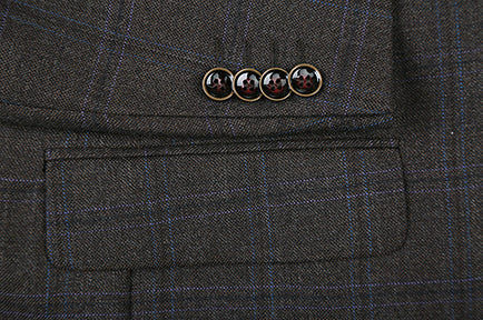 Close-up of a button on the brown Glen Plaid 100% Wool Regular Fit 2 Button Blazer jacket.