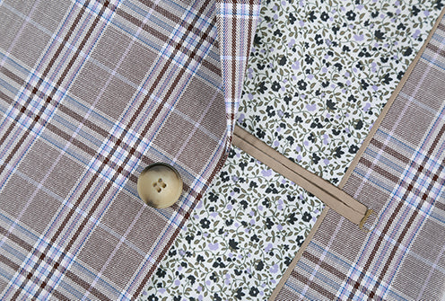 Close-up of a button on the gray Glen Plaid Gerace Collection suit jacket, showing collar and pocket.