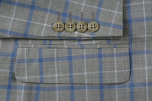 A close-up view of a button and collar on the Renoir gray 100% Wool Regular Fit 2 Piece Windowpane Dress Suit jacket.