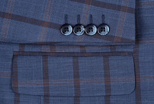 Close-up of a button on the Renoir Bova Collection - Stretch Suit 2 Piece Blue Glen Plaid Regular Fit jacket.