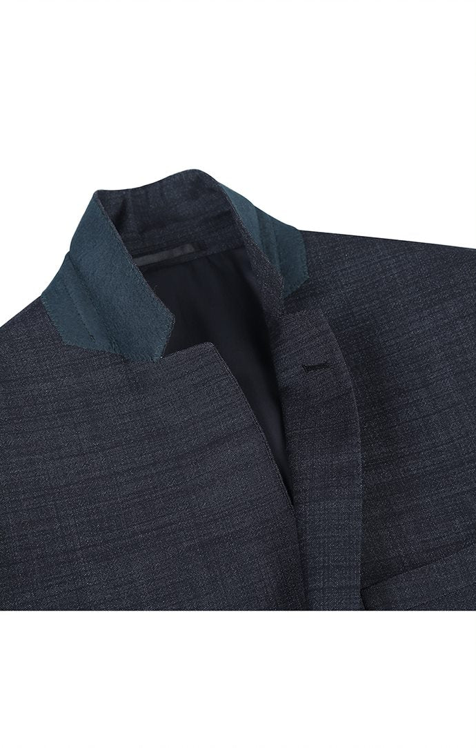 Close-up of the solid pocket detail on the Renoir Wool Blend Slim Fit Suit 2 Piece Suit 2 Button in Charcoal.