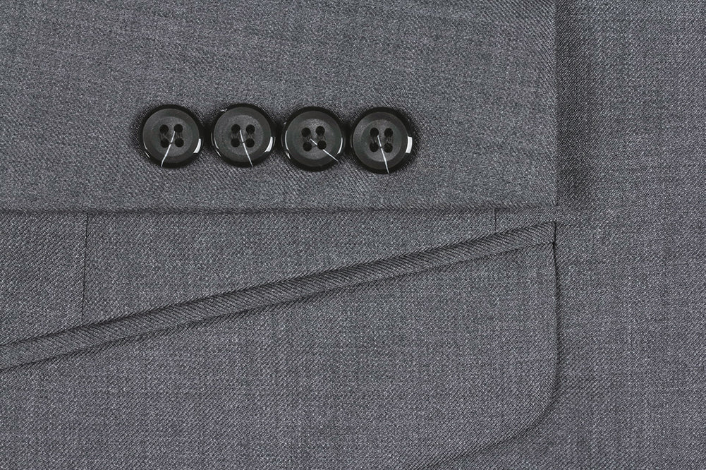 Close-up of a button with pick stitch detail on the solid Gray 100% Virgin Wool Slim Fit 2 Piece Suit 2 Button jacket.