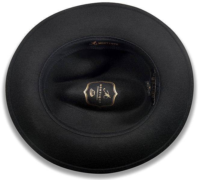 Montique solid black Wool Felt Fedora Pinch Front hat with feather accent.
