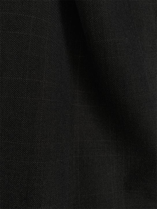 Close-up of black checkered Glen Plaid suit fabric weave, Olympia Collection Regular Fit 3 Piece.