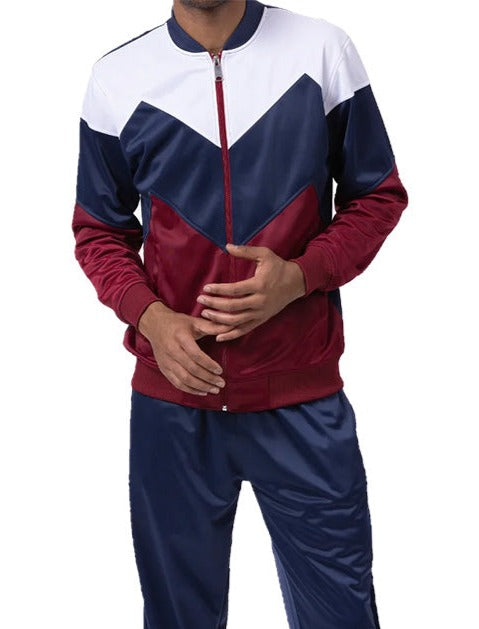 Person wearing a color-blocked tracksuit with white, blue, and red design on a white background