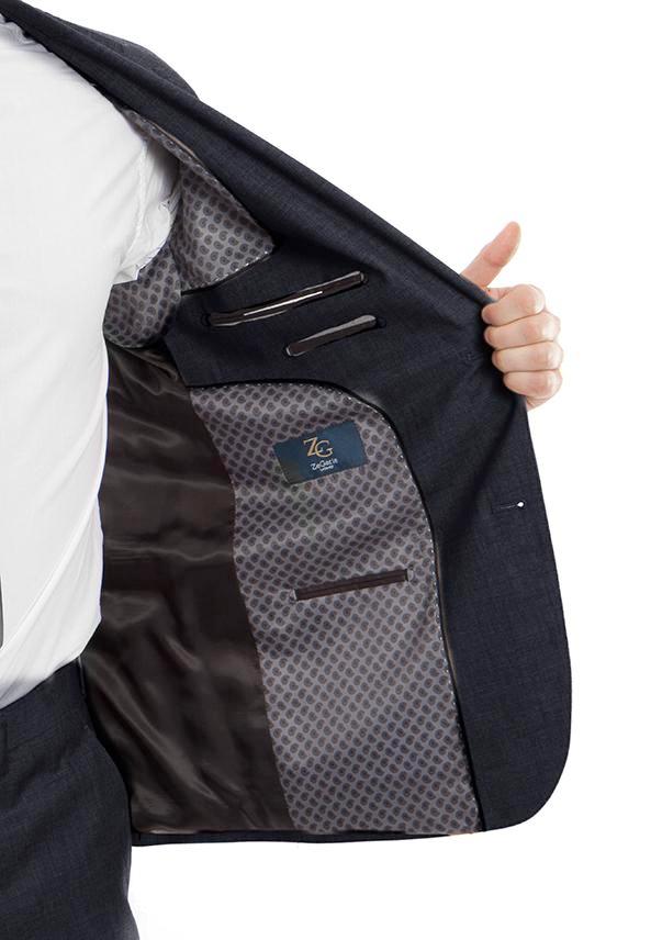 A solid Navy Arezzo Collection 100% Wool Modern Fit Italian Style 2 Piece jacket, showing tie, collar, button, and pocket.