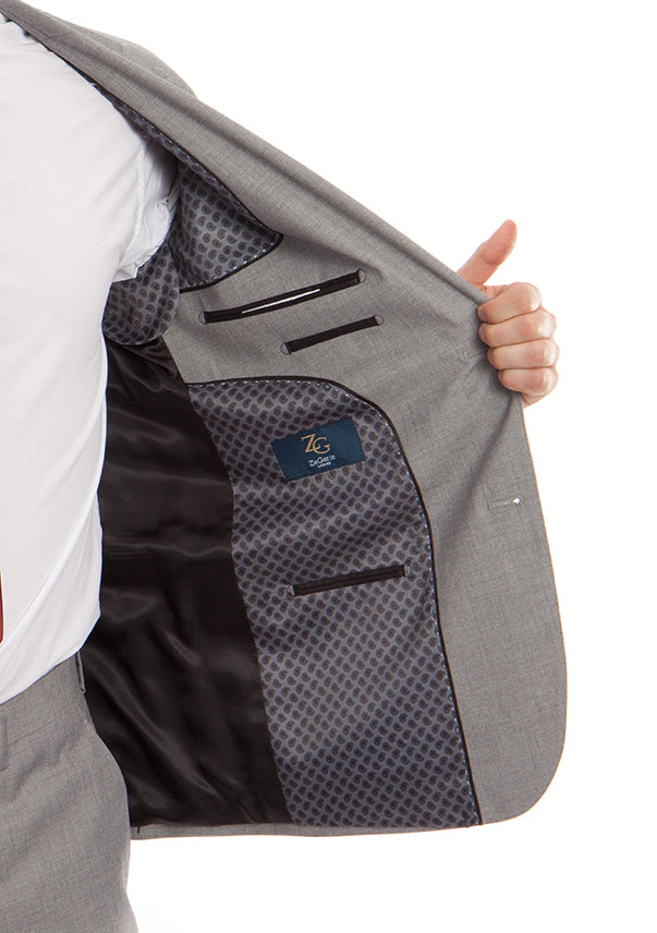 Tazio 100% Wool Modern Fit 2 Piece Gray Suit jacket, solid gray, showing collar, buttons, and a pocket.