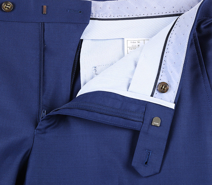 Close-up view of the solid blue pocket detail on the Renoir Half Canvas Wool Dress Suit Modern Fit 2 Piece.