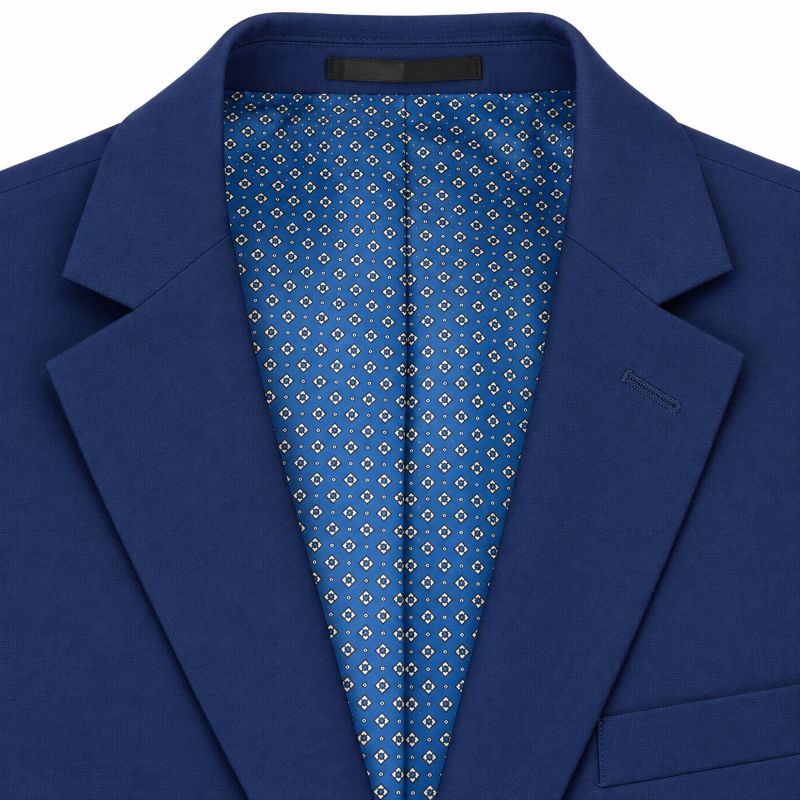 Close-up of a royal blue suit jacket with a patterned blue and white lining visible inside the collar.