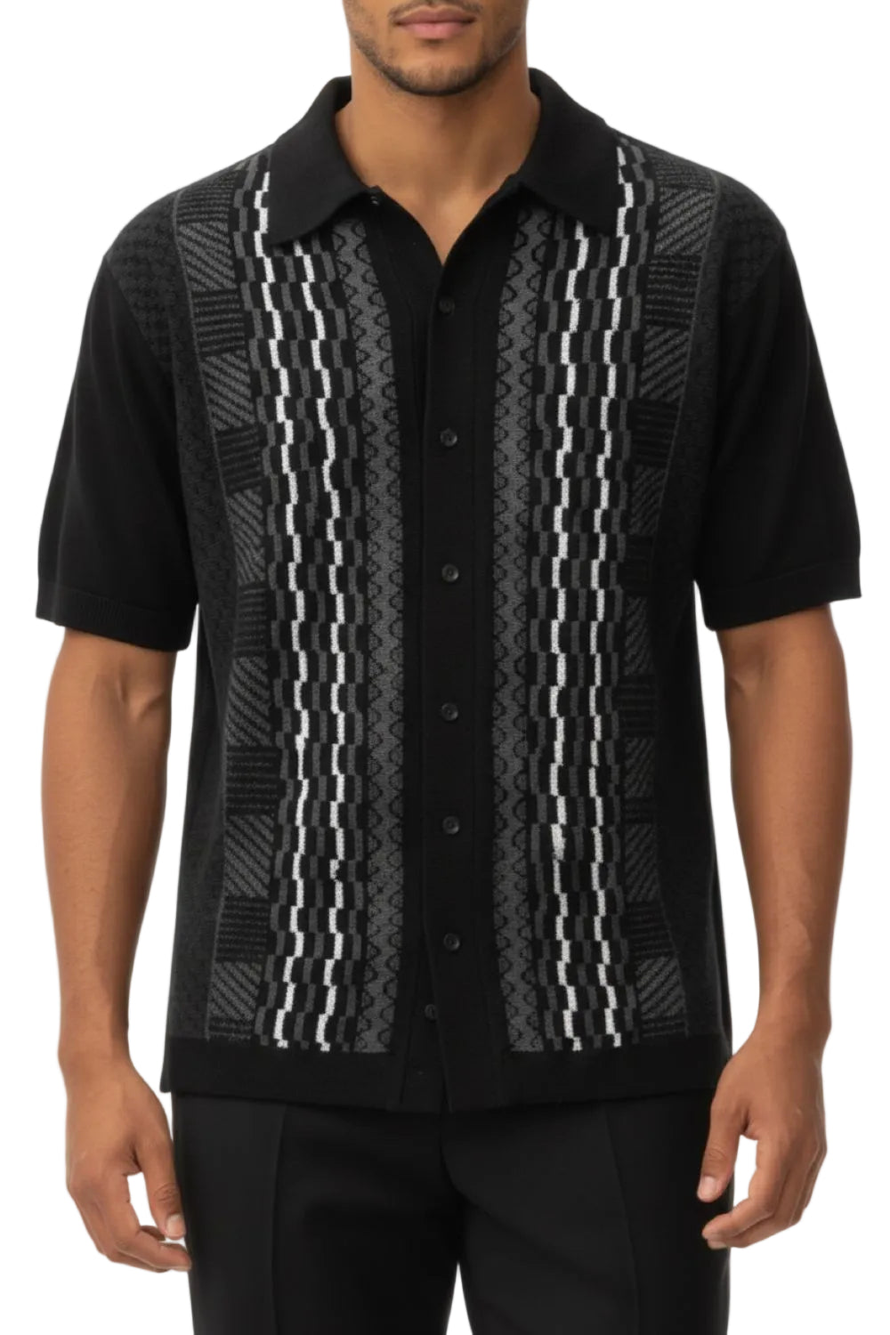 Black patterned shirt worn by a person on a white background
