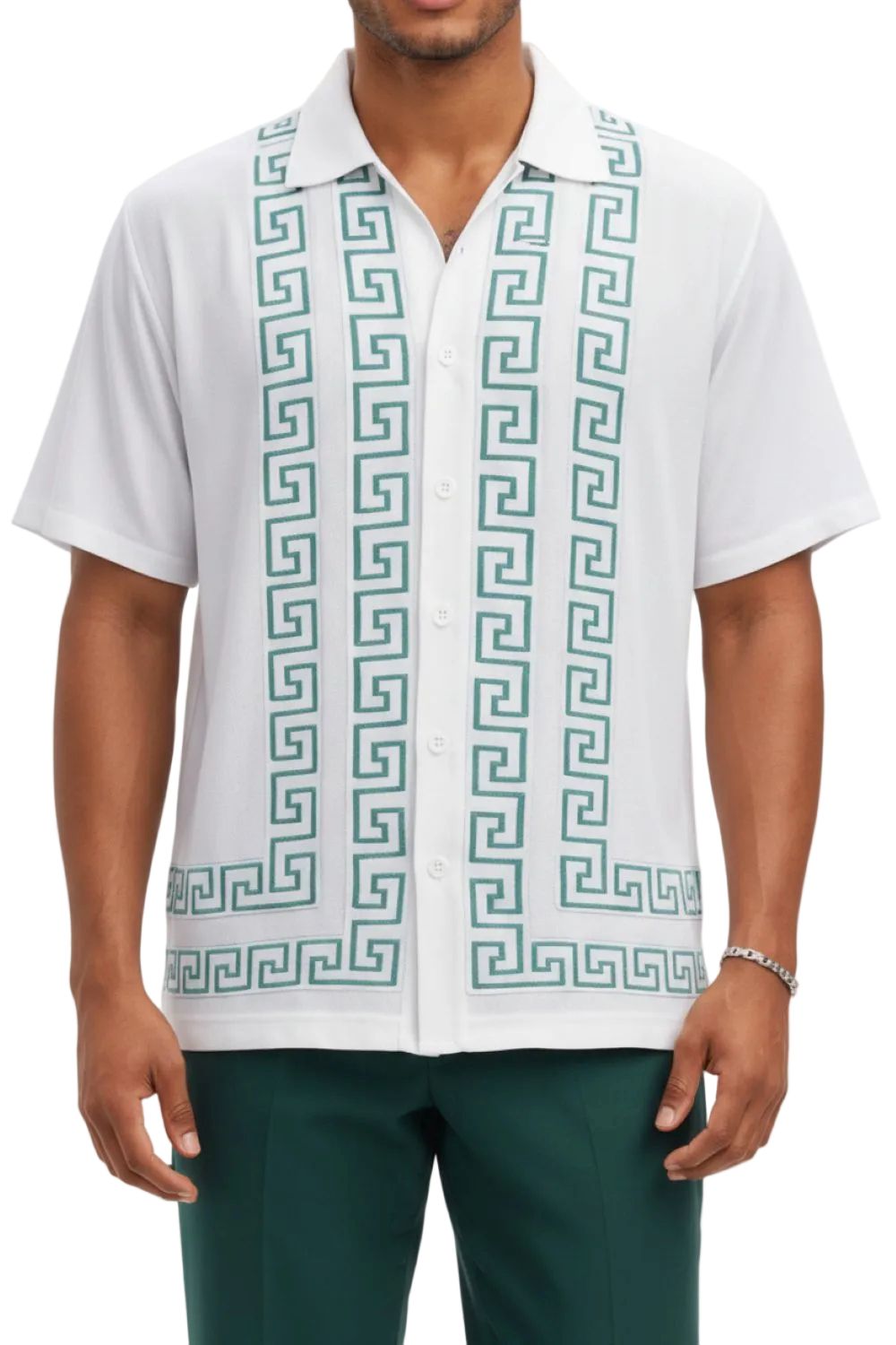 Man wearing a white shirt with green geometric pattern and green pants on a white background