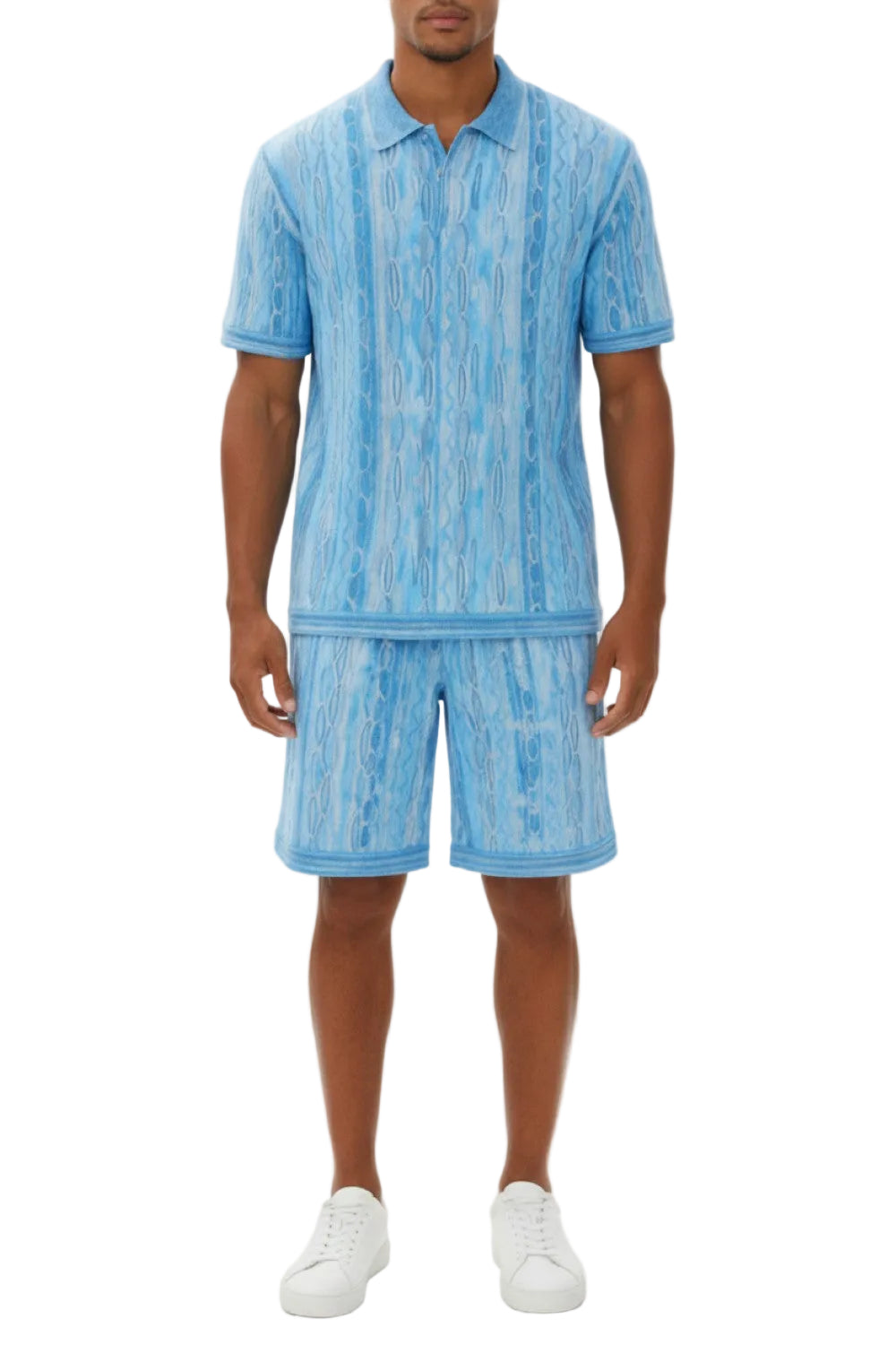 Man wearing a blue patterned outfit with a shirt and shorts on a white background