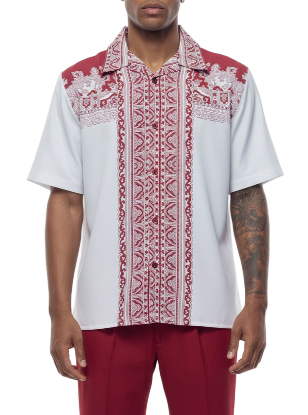 Man wearing a white shirt with red and white patterned accents on a white background